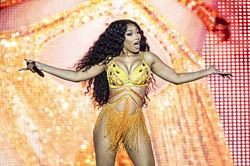 Megan Thee Stallion seen admitting she "stepped on glass" while lying on a hospital bed after the alleged Tory Lanez shooting incident