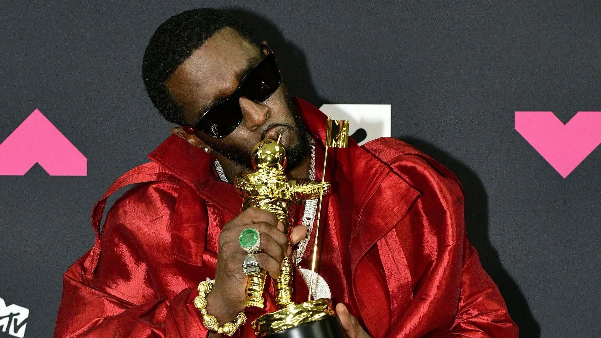 Sean &ldquo;Diddy&rdquo; Combs poses with the &quot;Global Icon Award&quot; in the press room at the 2023 MTV Video Music Awards (Image via Getty)
