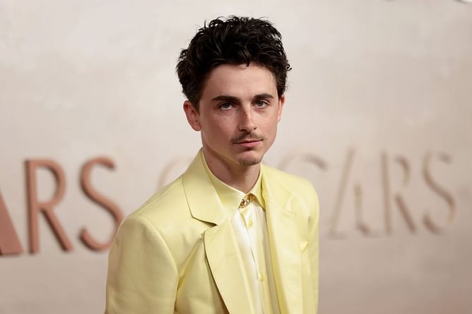 "That song is older than he is" — Internet reacts to Timothée Chalamet rapping to The Game and 50 Cent's ‘Hate It Or Love It’ with Saquon Barkley