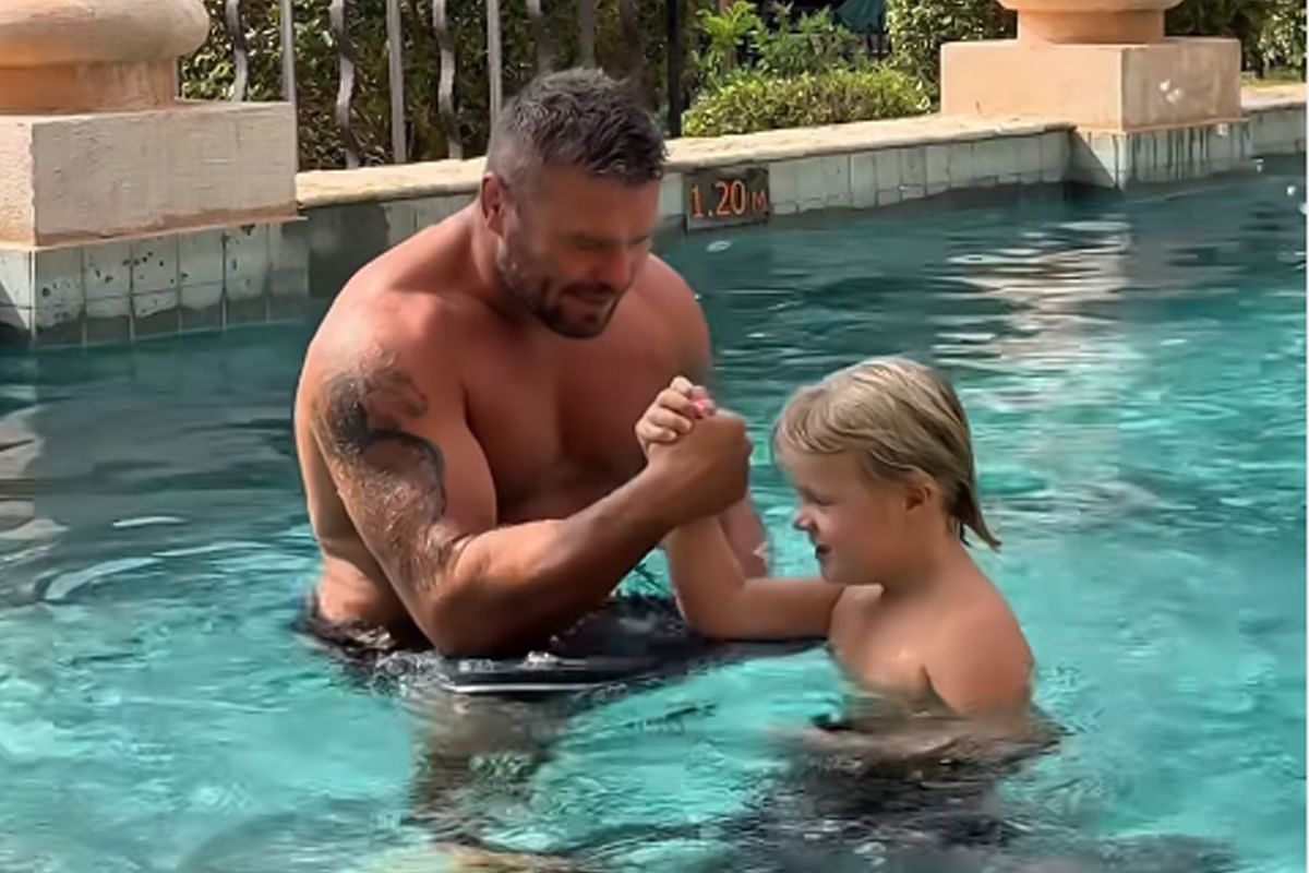 Anatoly Malykhin and his son Leo in the pool