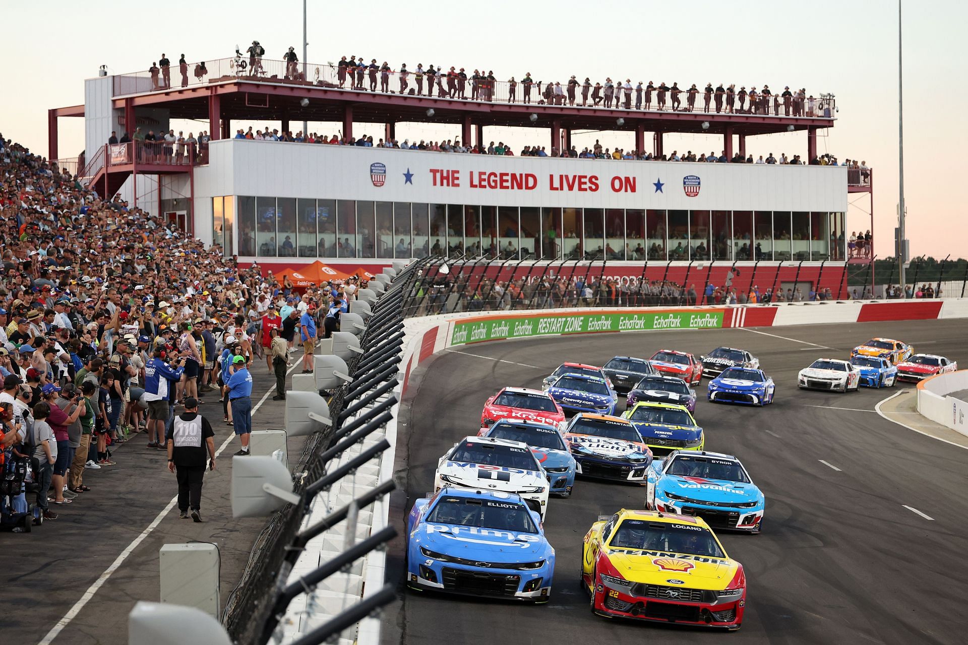 NORTH WILKESBORO, NORTH CAROLINA - MAY 18: Joey Logano, driver of the #22 Shell Pennzoil Ford, and Chase Elliott, driver of the #9 Amazon Prime Video Chevrolet, race during the NASCAR Cup Series All-Star Race at North Wilkesboro Speedway on May 18, 2025 in North Wilkesboro, North Carolina. (Photo by David Jensen/Getty Images) - Source: Getty