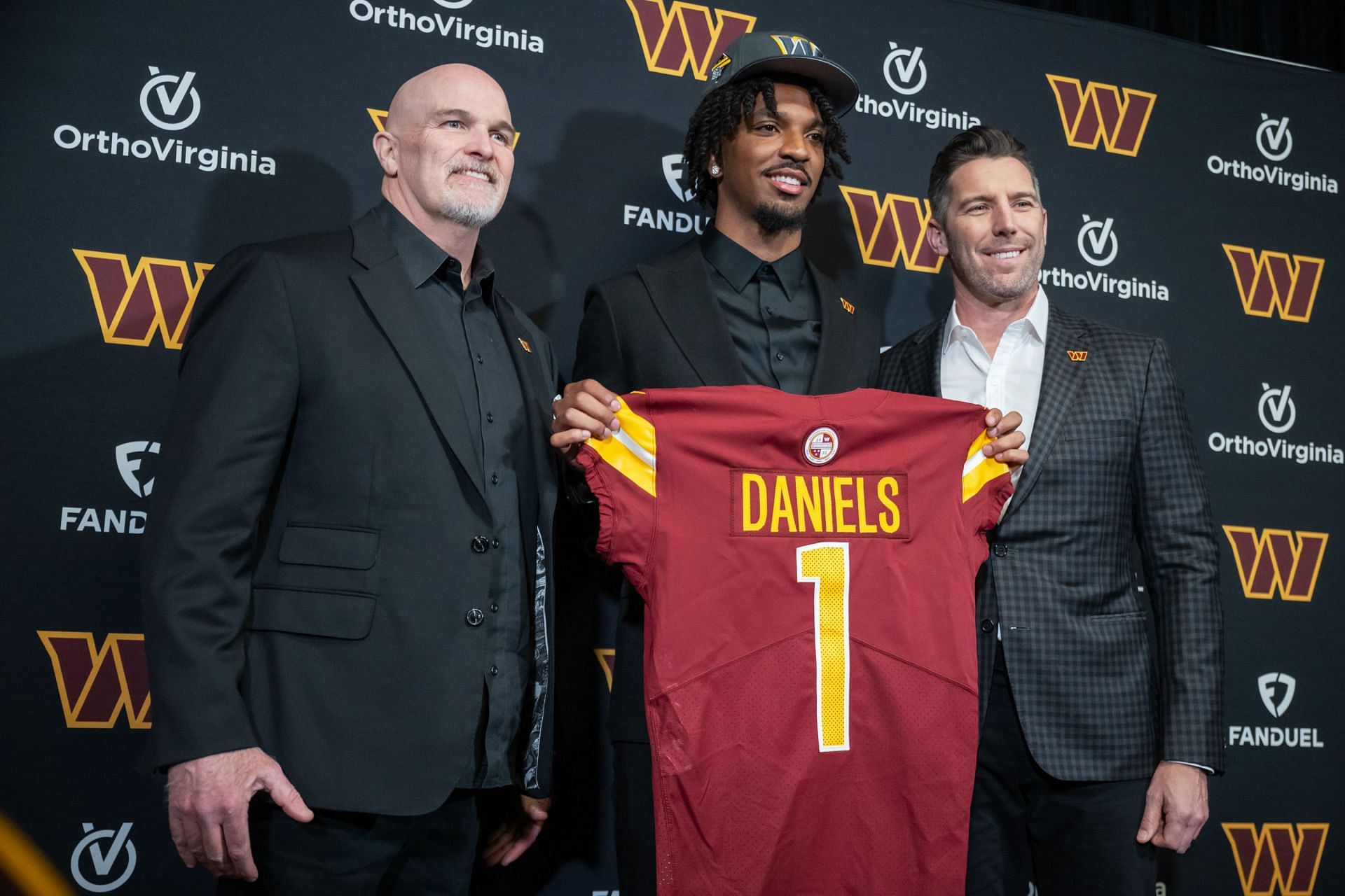ASHBURN, VA - APRIL 26: Quarterback Jayden Daniels poses with C - Source: Getty