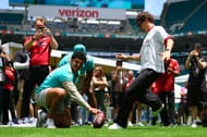 Charles Leclerc plays American football in the Paddock during the Miami Grand Prix previews. Source: Getty