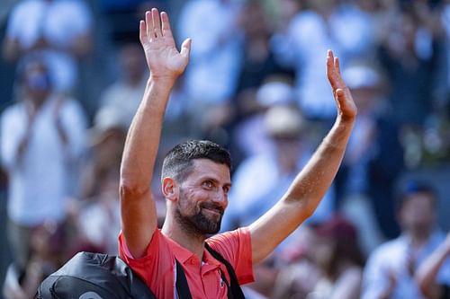 Novak Djokovic leaves the Manolo Santana court in Madrid's Caja Magica after his second-round loss to Matteo Arnaldi at the 2025 Madrid Open (Source: Getty)