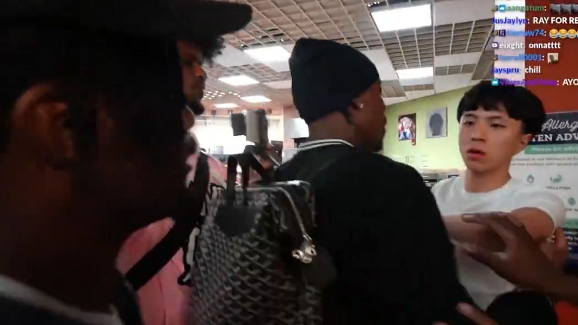Tylil James holds back Ray to prevent a fight (Images via X/@LithiumClips)