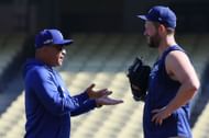 Dodgers skipper Dave Roberts chats with starting pitcher Clayton Kershaw during a team workout - Source: Getty