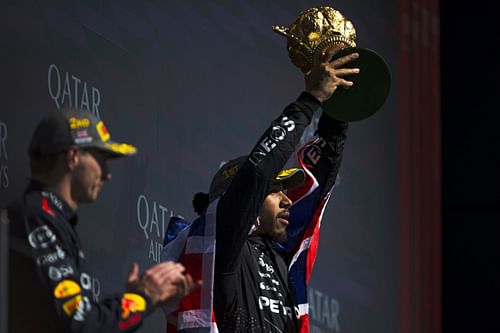 Lewis Hamilton celebrates on the podium during the F1 Grand Prix of Great Britain at Silverstone Circuit on July 07, 2024- Source: Getty