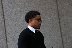 Woman kisses Diddy’s son, Justin Combs, on the cheek outside the courthouse during trial and jumps with joy