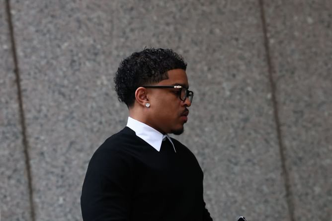 Woman kisses Diddy’s son, Justin Combs, on the cheek outside the courthouse during trial and jumps with joy