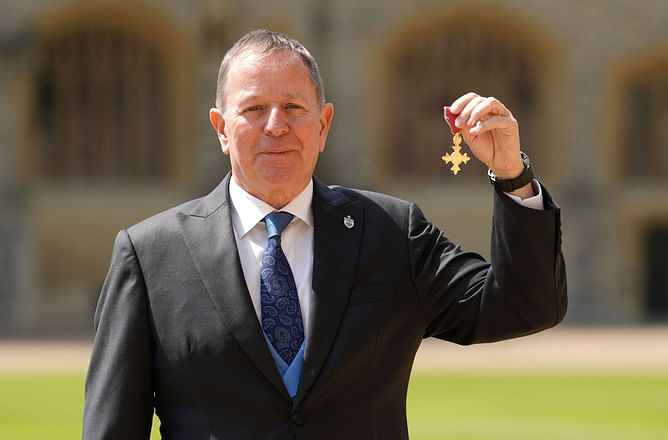 F1 commentator Martin Brundle makes his feelings known on receiving his OBE from the Prince of Wales
