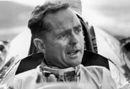 American Grand Prix racing car driver Phil Hill talks to the pit crew in 1961. Source: Getty