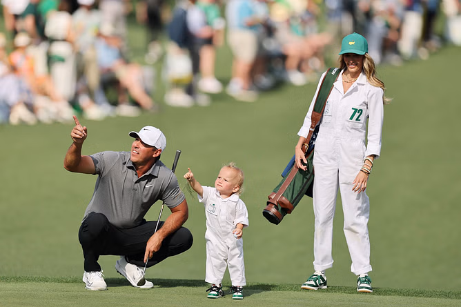 Brooks Koepka and Jena Sims pose with their son after making him ‘smile before bedtime’