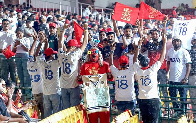 Fans grace the M Chinnaswamy Stadium with white jerseys as tribute to Virat Kohli's Test career during RCB vs KKR IPL 2025 match [In Pictures]