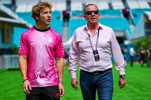 Liam Lawson of New Zealand and Visa Cash App RB walks in the paddock with Martin Brundle of Sky Sports - Source: Getty