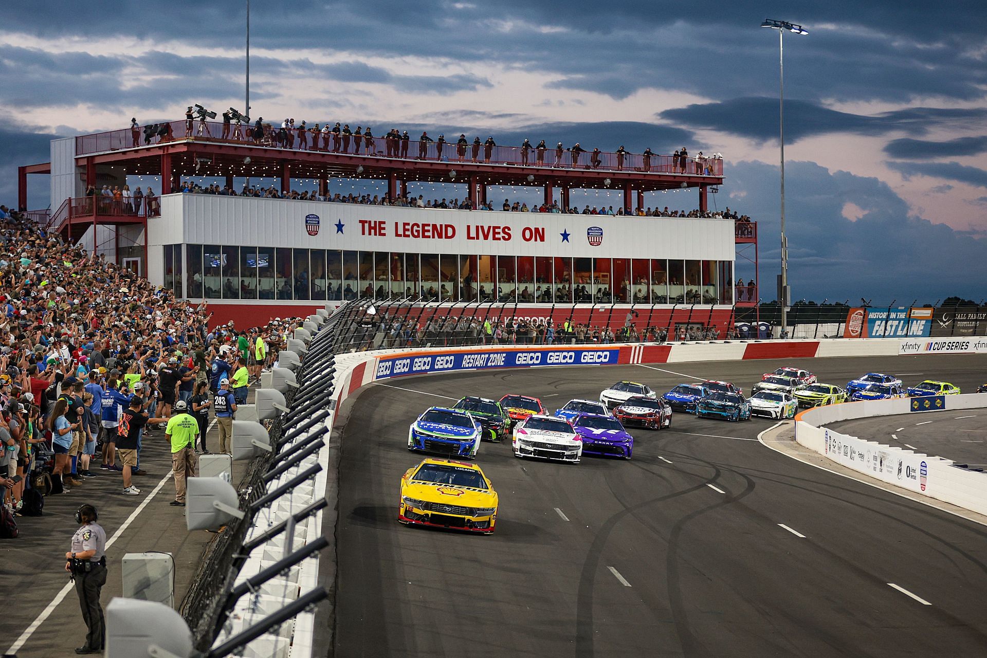 NORTH WILKESBORO, NORTH CAROLINA - MAY 19: Joey Logano, driver of the #22 Shell Pennzoil Ford, leads the field during the NASCAR Cup Series All-Star Race at North Wilkesboro Speedway on May 19, 2024 in North Wilkesboro, North Carolina. (Photo by James Gilbert/Getty Images) - Source: Getty