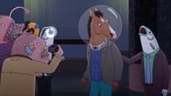 BoJack arrives at the underwater film festival after party, disoriented and feeling like an outsider as photographers swarm him. (image via Netflix)