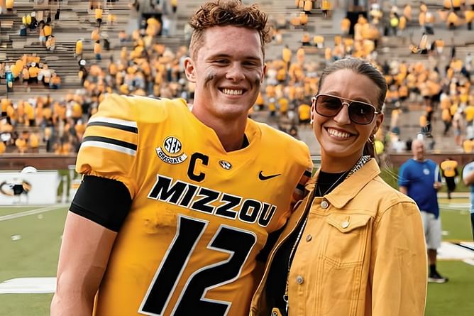 Brady Cook's fiancée Carli beams with pride as Jets QB's sister Ellie graduates from Missouri State University