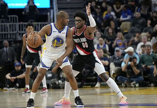 Scoot Henderson #00 of the Portland Trail Blazers guards Chris Paul #3 - Source: Getty