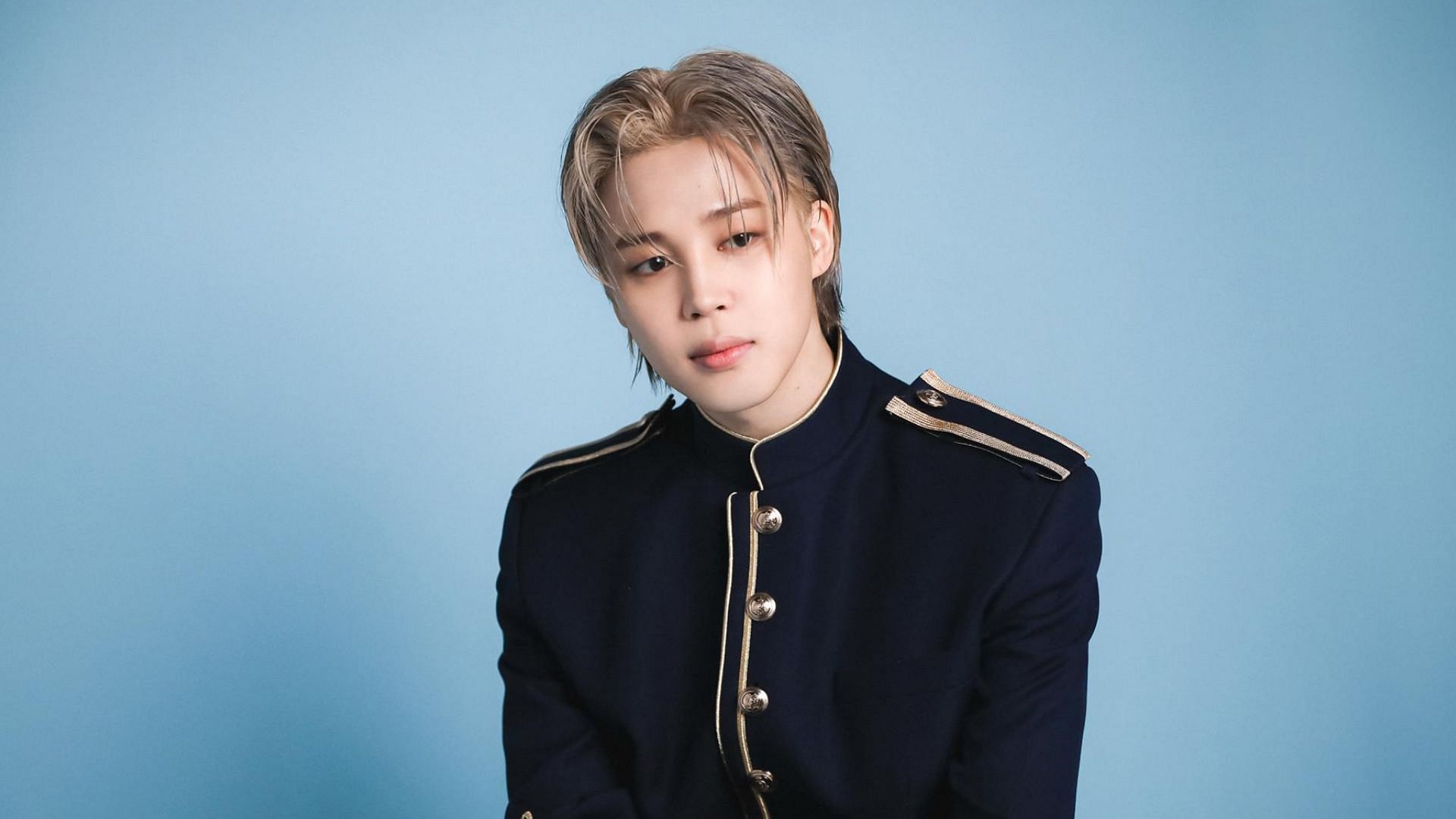 Jimin gifts bouquet to his father (Image via Weverse)