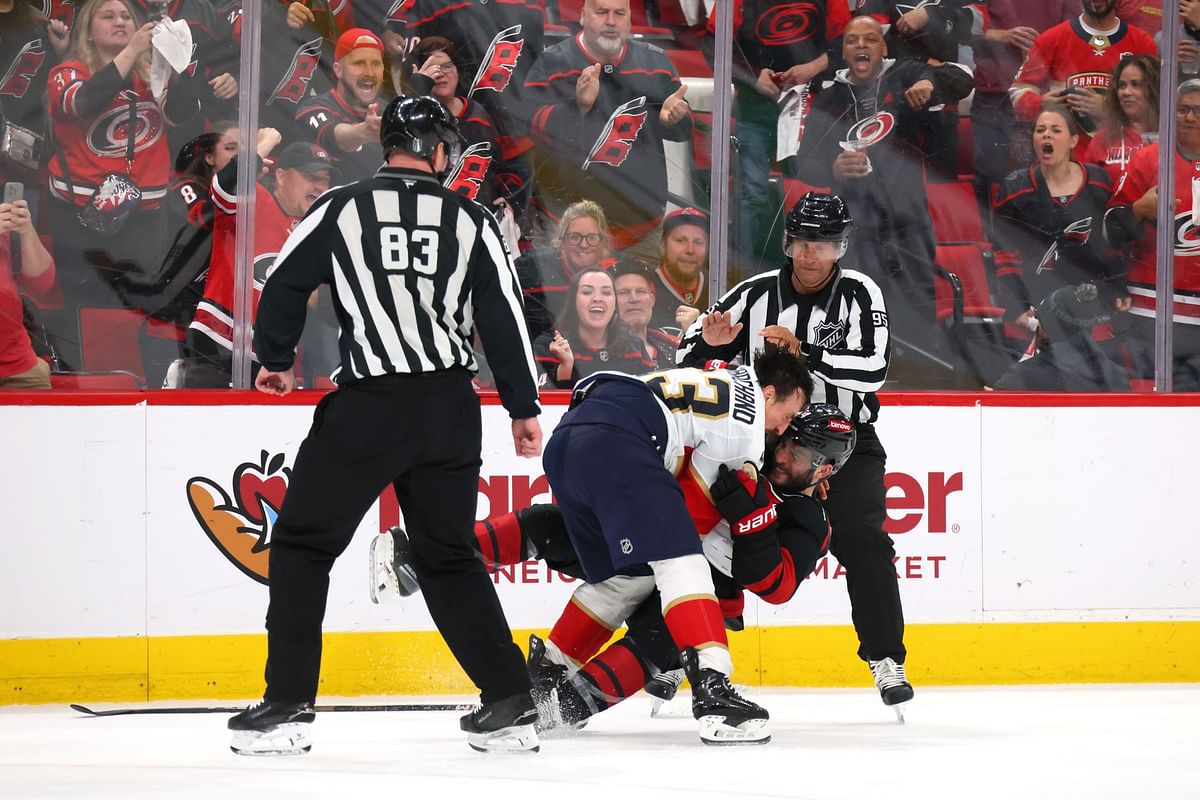 WATCH: Brad Marchand ejected for short scrap with Shayne Gostibehere after latter fired puck at Panthers veteran