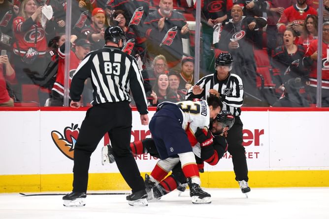 WATCH: Brad Marchand ejected for short scrap with Shayne Gostisbehere after latter fired puck at Panthers veteran