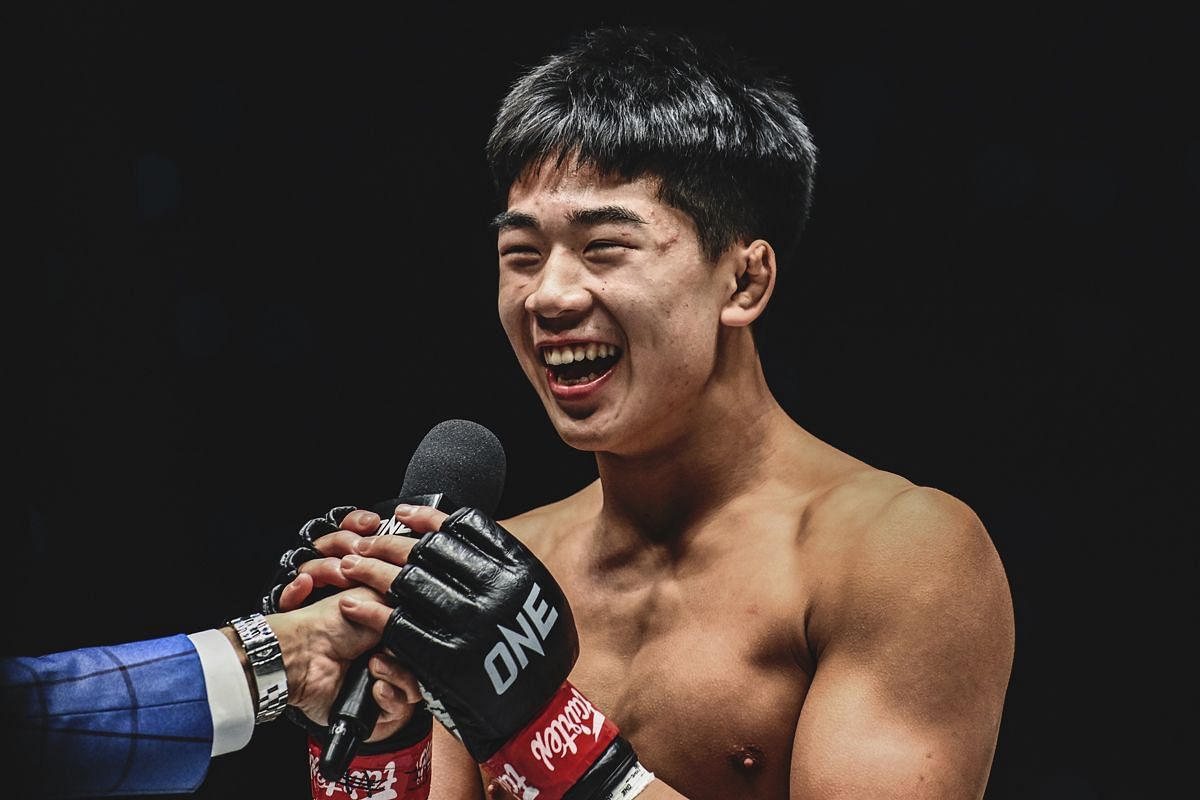 Adrian Lee smiles brightly in the Circle