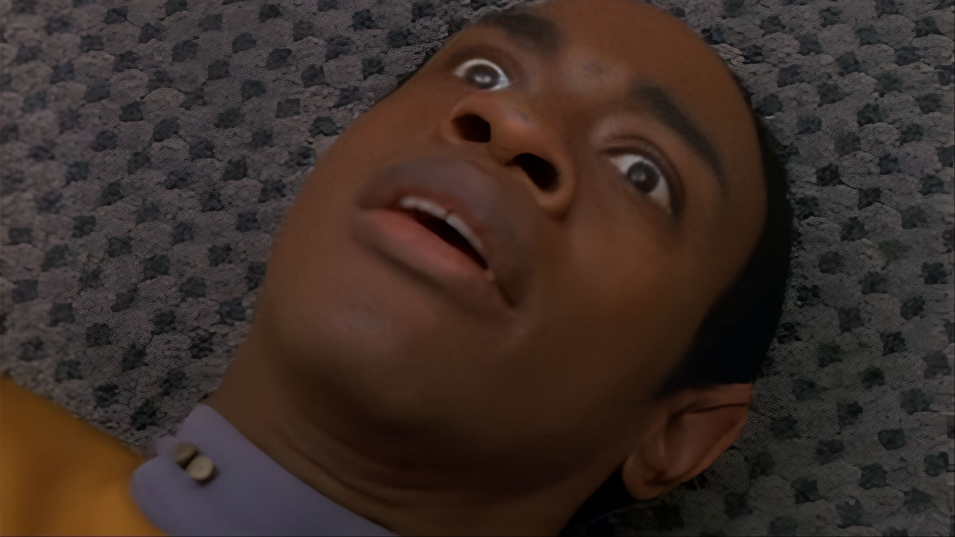 A rare moment of vulnerability: Tuvok lies disoriented on the floor, his control momentarily slipping in Star Trek: Voyager (Image via Netflix)
