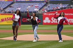 Alexis Holmes makes her feelings known on throwing the first pitch alongside Sydney McLaughlin-Levrone and Gabby Thomas at the Phillies-Braves game