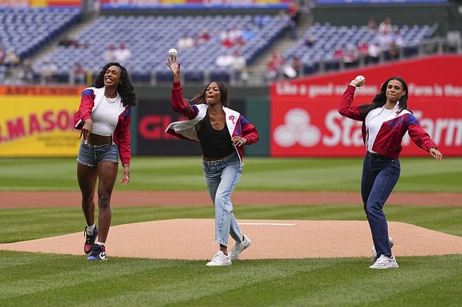 Alexis Holmes makes her feelings known on throwing the first pitch alongside Sydney McLaughlin-Levrone and Gabby Thomas at the Phillies-Braves game