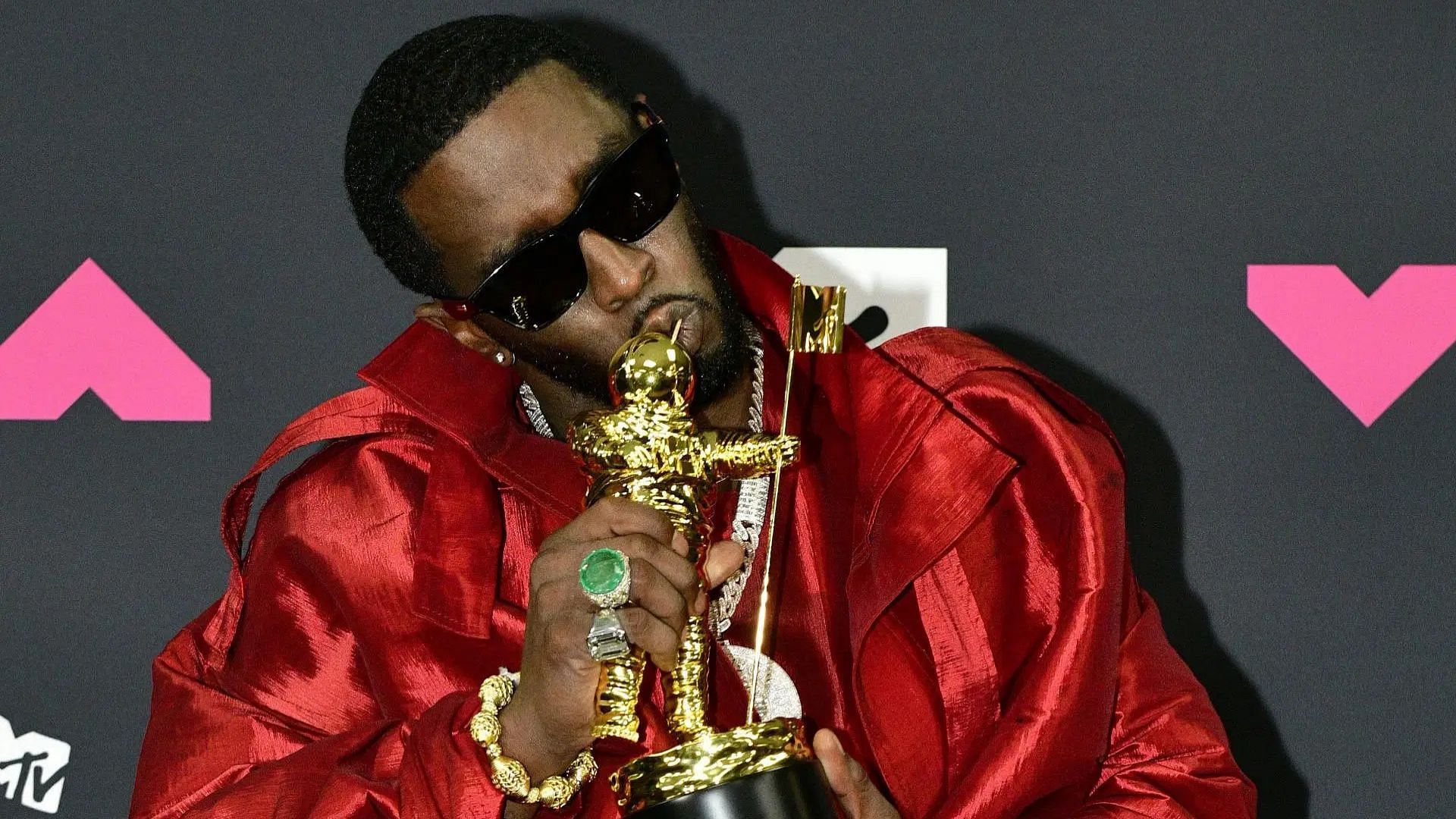 Sean &ldquo;Diddy&rdquo; Combs poses with the &quot;Global Icon Award&quot; in the press room at the 2023 MTV Video Music Awards (Image via Getty)
