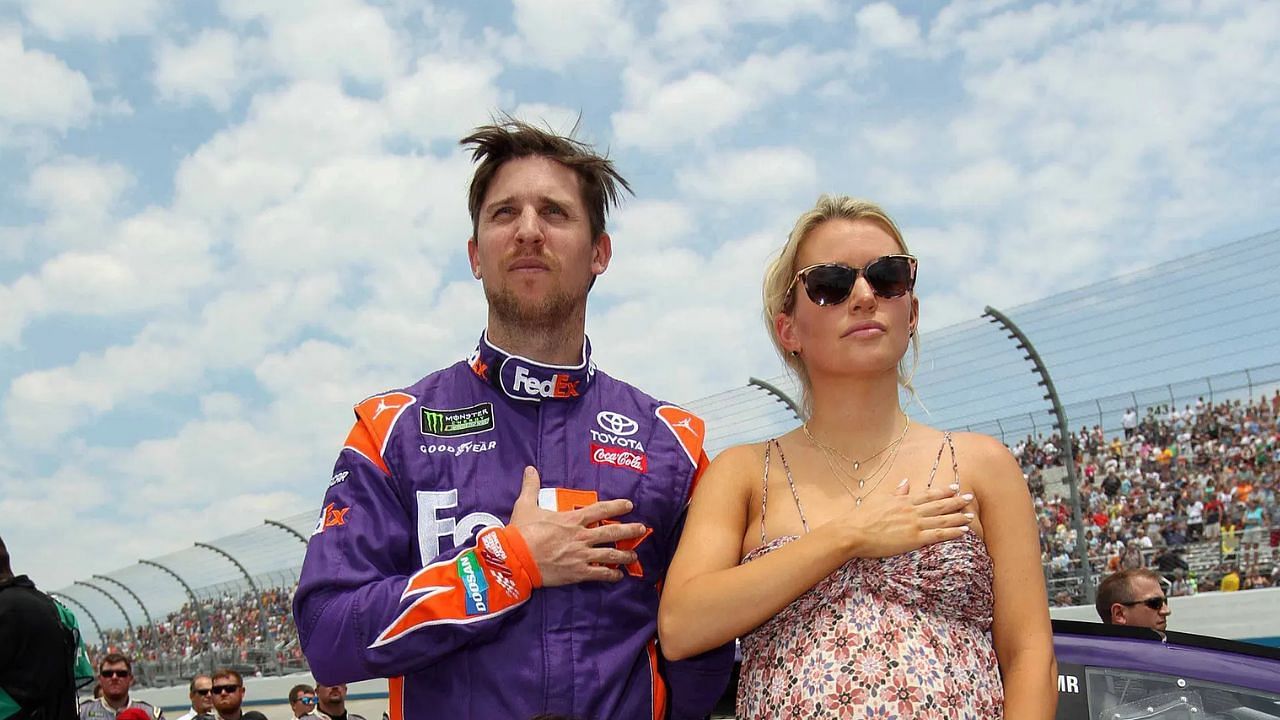 Denny Hamlin stands on pit road with his Jordan Fish at Dover International Speedway on Jun 4, 2017. Mandatory C