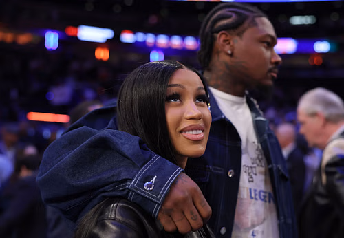 Stefon Diggs (R) with Cardi B at the Celtics vs Knicks NBA playoff Game 4 - Source: Getty