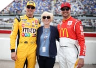Brothers Kyle Busch and Kurt Busch pose with their mother, Gaye Busch, before the 2022 Goodyear 400 at Darlington. Source: Getty