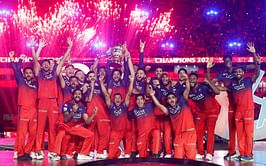 RCB captain Rajat Patidar lifts the IPL 2025 Trophy joyously with teammates on the podium [Watch]