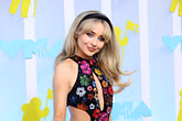 Carly Simon thinks Sabrina Carpenter went "over the line a little bit" when she touched the man's knee on the cover of her album "Man's Best Friend"
