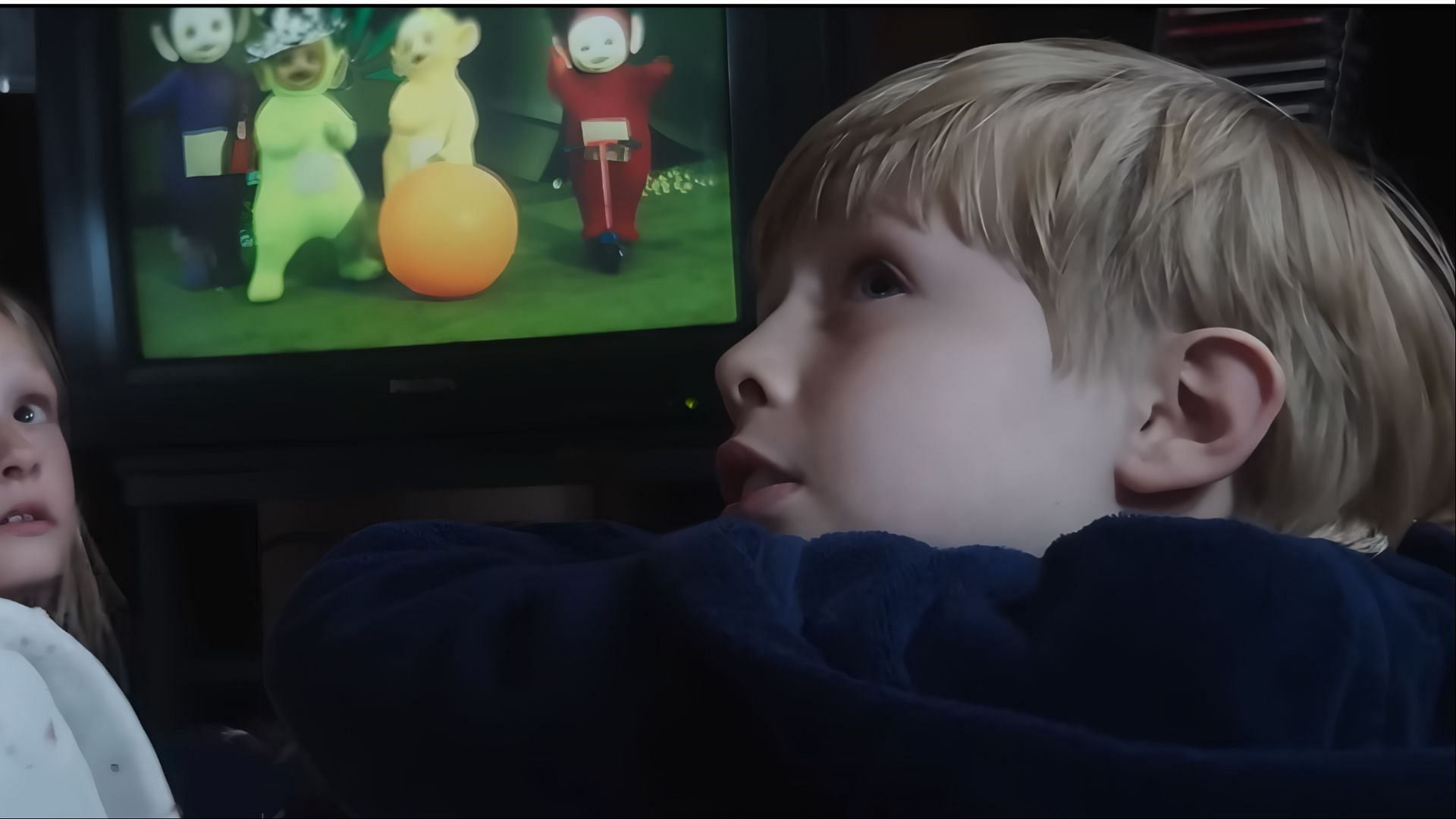A young boy watching Teletubbies on TV in 28 Years Later, representing Jimmy before the Rage Virus outbreak.