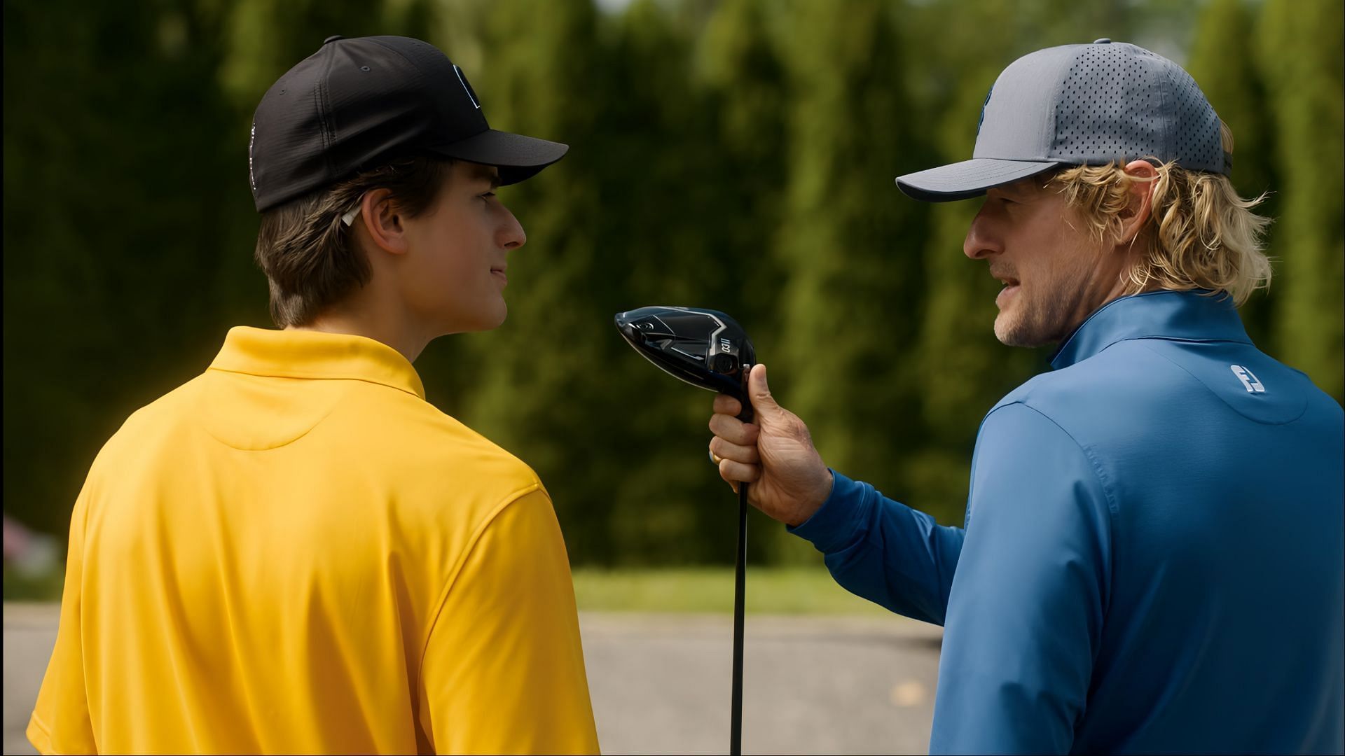 Pryce guides Santi through his next move on the course in Stick season 1, navigating pressure and past regrets. (AppleTV)  