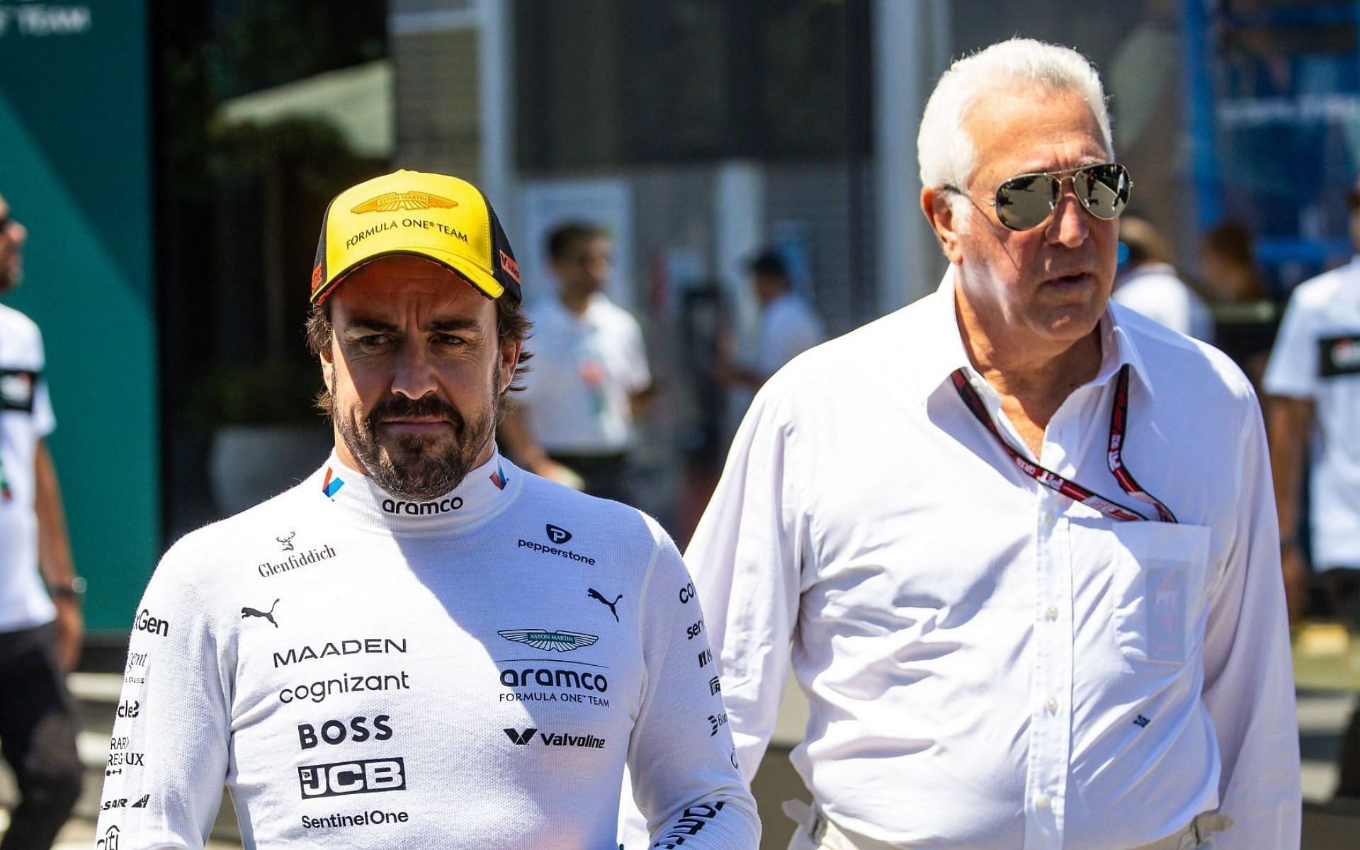 Fernando Alonso (L) and Lawrence Stroll (R)