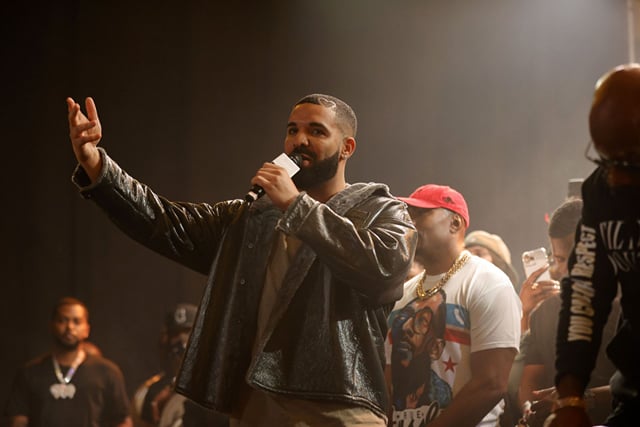 Photo of Drake showing off his abs in front of a bar counter goes viral