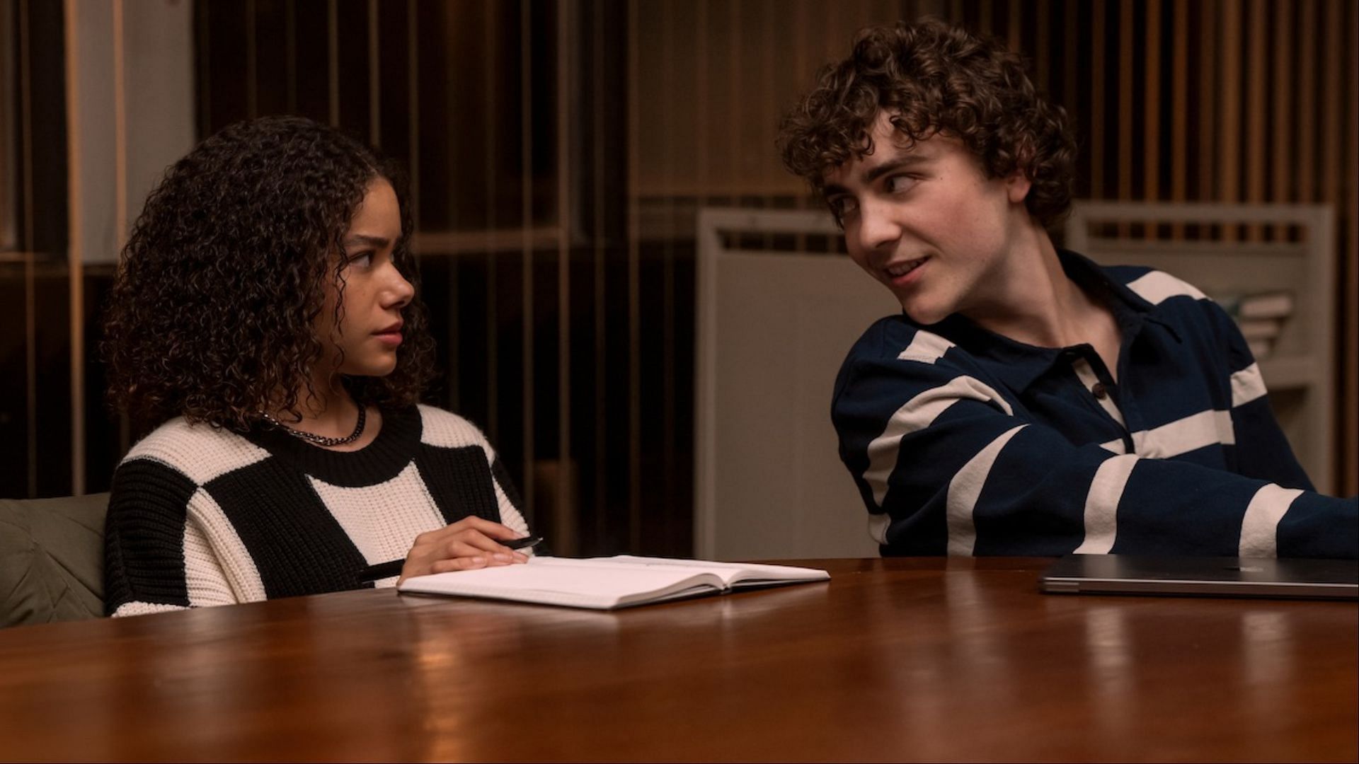 Wolfe and Ginny exchange a loaded glance in Ginny &amp; Georgia season 3. (Image via Netflix)
