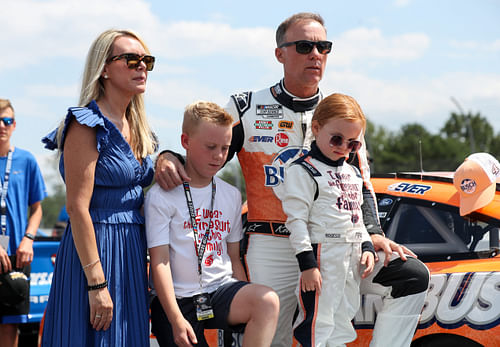 Kevin Harvick stands with his wife DeLana Harvick and son Keelan and daughter Piper at Pocono. Source: Imagn