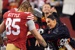 George Kittle and wife Claire steal a romantic moment while sweating it out at the gym together [PIC]