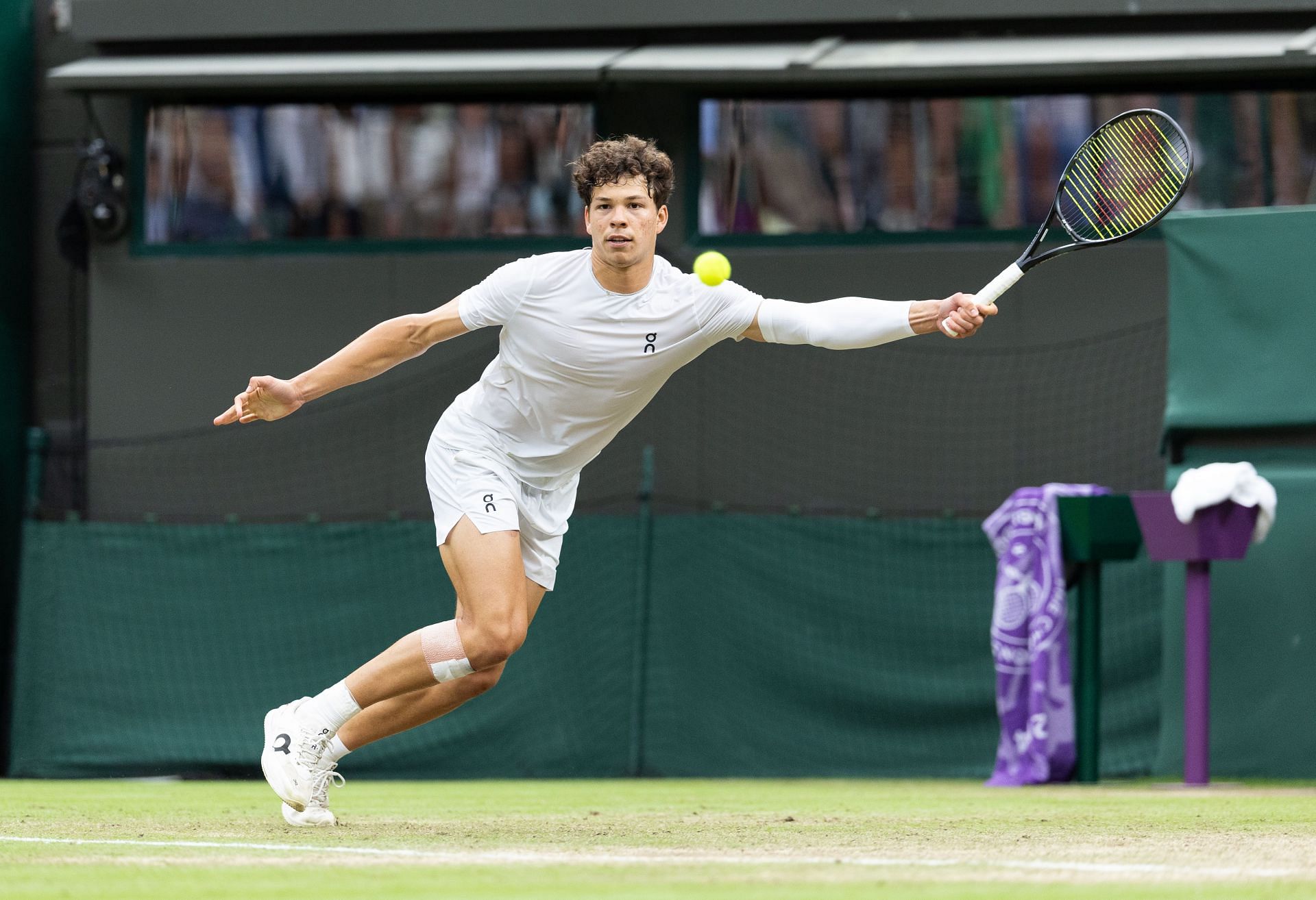 Ben Shelton retrieves a ball at Wimbledon 2024 | Image Source: Getty