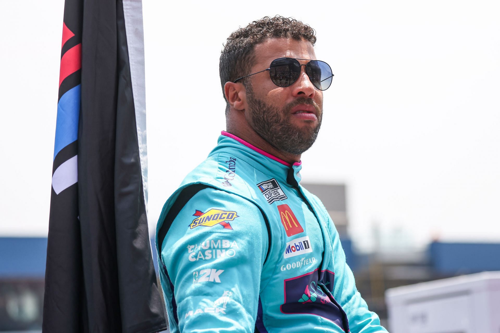 BROOKLYN, MI - JUNE 08:  Bubba Wallace (#23 23XI Racing Columbia Toyota) looks on before the start of the NASCAR Cup Series FireKeepers Casino 400 race on June 8, 2025 at Michigan International Speedway in Brooklyn, MI.(Photo by Scott W. Grau/Icon Sportswire via Getty Images) - Source: Getty