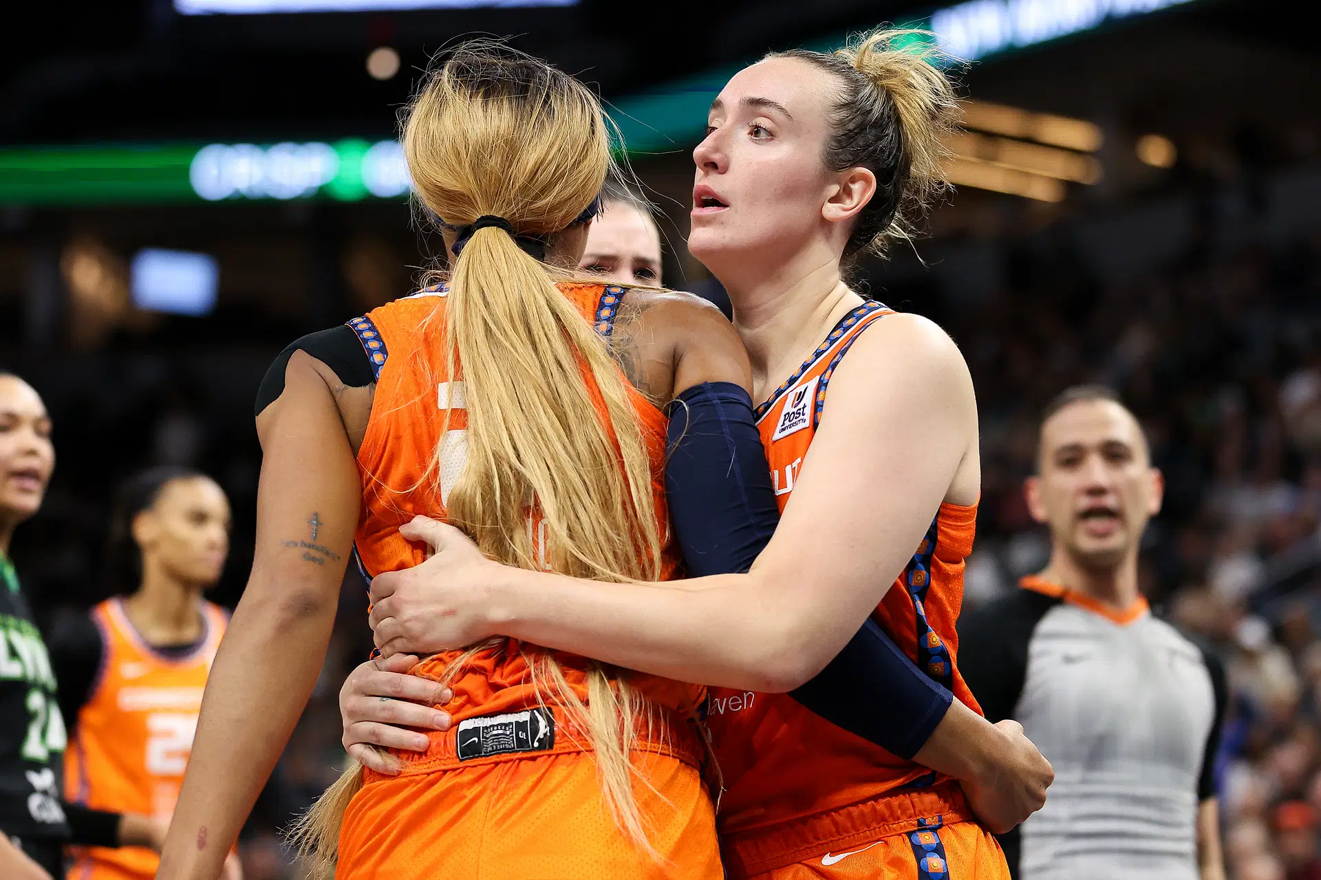 Oct 1, 2024; Minneapolis, Minnesota, USA; Connecticut Sun guard Marina Mabrey (4) holds back guard DiJonai Carrington (21) during the second half of game two of the 2024 WNBA Semi-finals against the Minnesota Lynx at Target Center. Mandatory Credit: Matt Krohn-Imagn Images - Source: Imagn