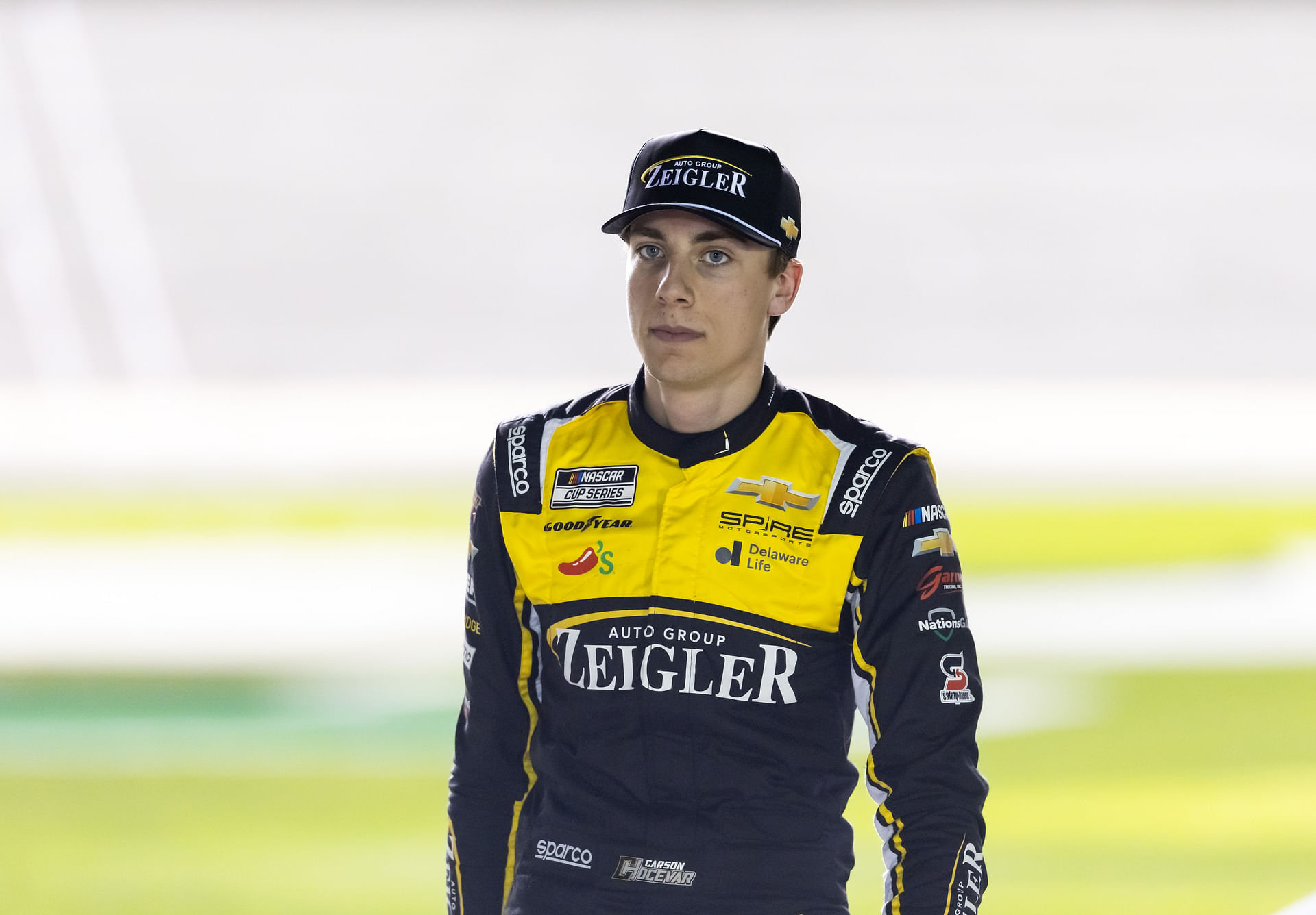 Feb 12, 2025; Daytona Beach, Florida, USA; NASCAR Cup Series driver Carson Hocevar (77) during qualifying for the Daytona 500 at Daytona International Speedway. Mandatory Credit: Mark J. Rebilas-Imagn Images - Source: Imagn