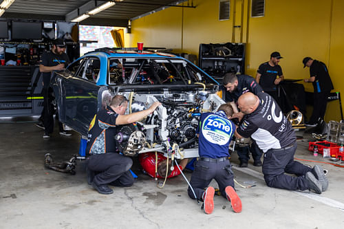 Trackhouse Racing crew work on the car of NASCAR Cup Series driver Helio Castroneves at Daytona 500. Source: Imagn