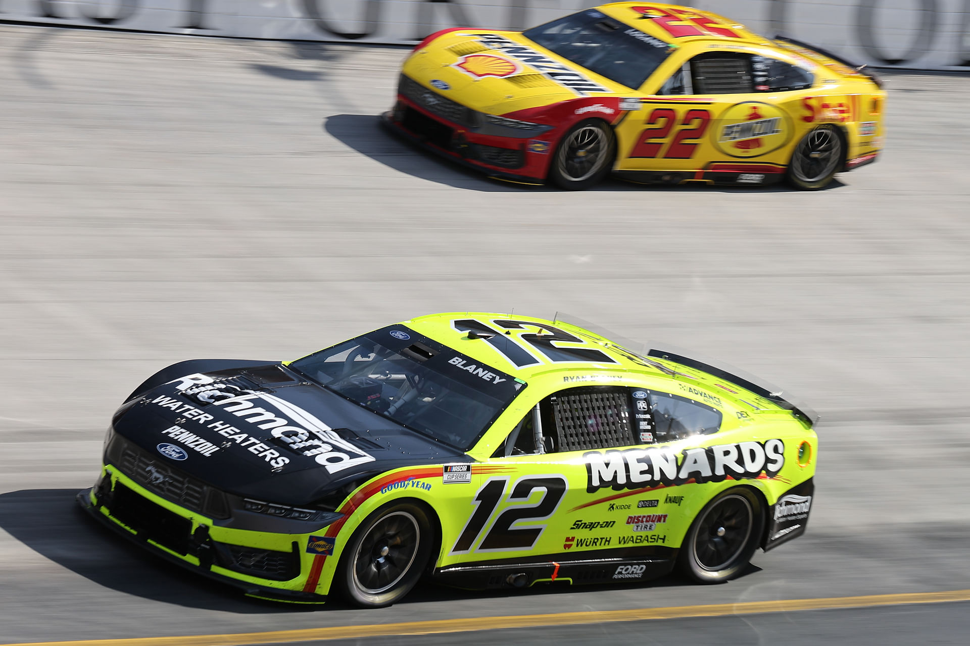 Team Penske&#039;s Ryan Blaney (12) leads Joey Logano (22) during the NASCAR Food City 500. Source: Imagn