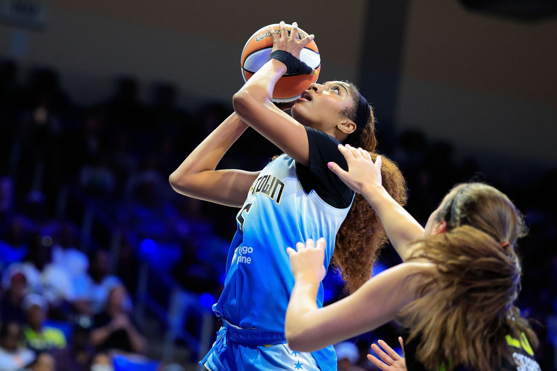 Angel Reese going up for a layup - Source: Getty