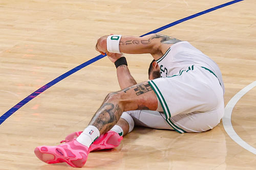 Boston Celtics forward Jayson Tatum (0) reacts on the court after an injury in the second half during game four of the second round for the 2025 NBA Playoffs against the New York Knicks at Madison Square Garden. Mandatory Credit: Vincent Carchietta-Imagn Images